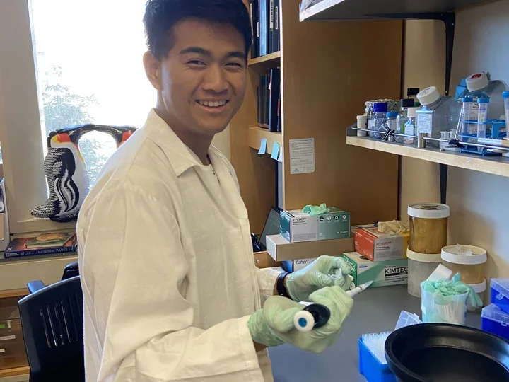 Harry Chen holding a pipette